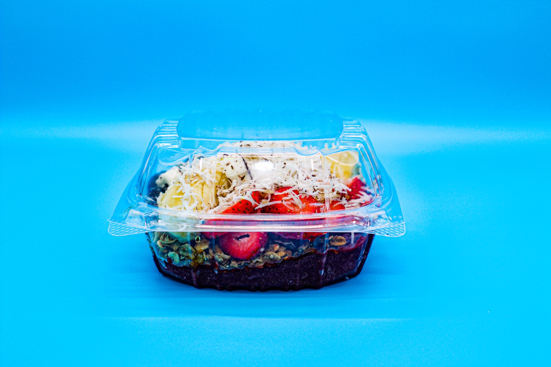 Acai bowl with granola, banana and strawberries