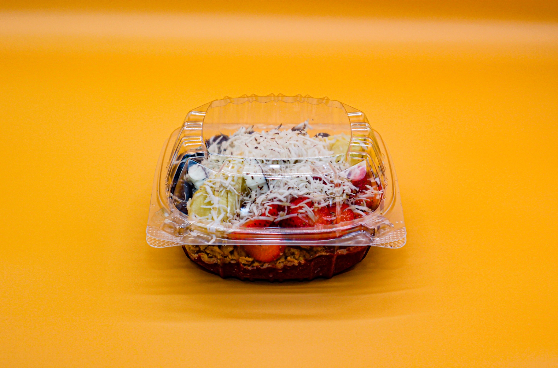 Acai bowl with strawberries, banana and coconut