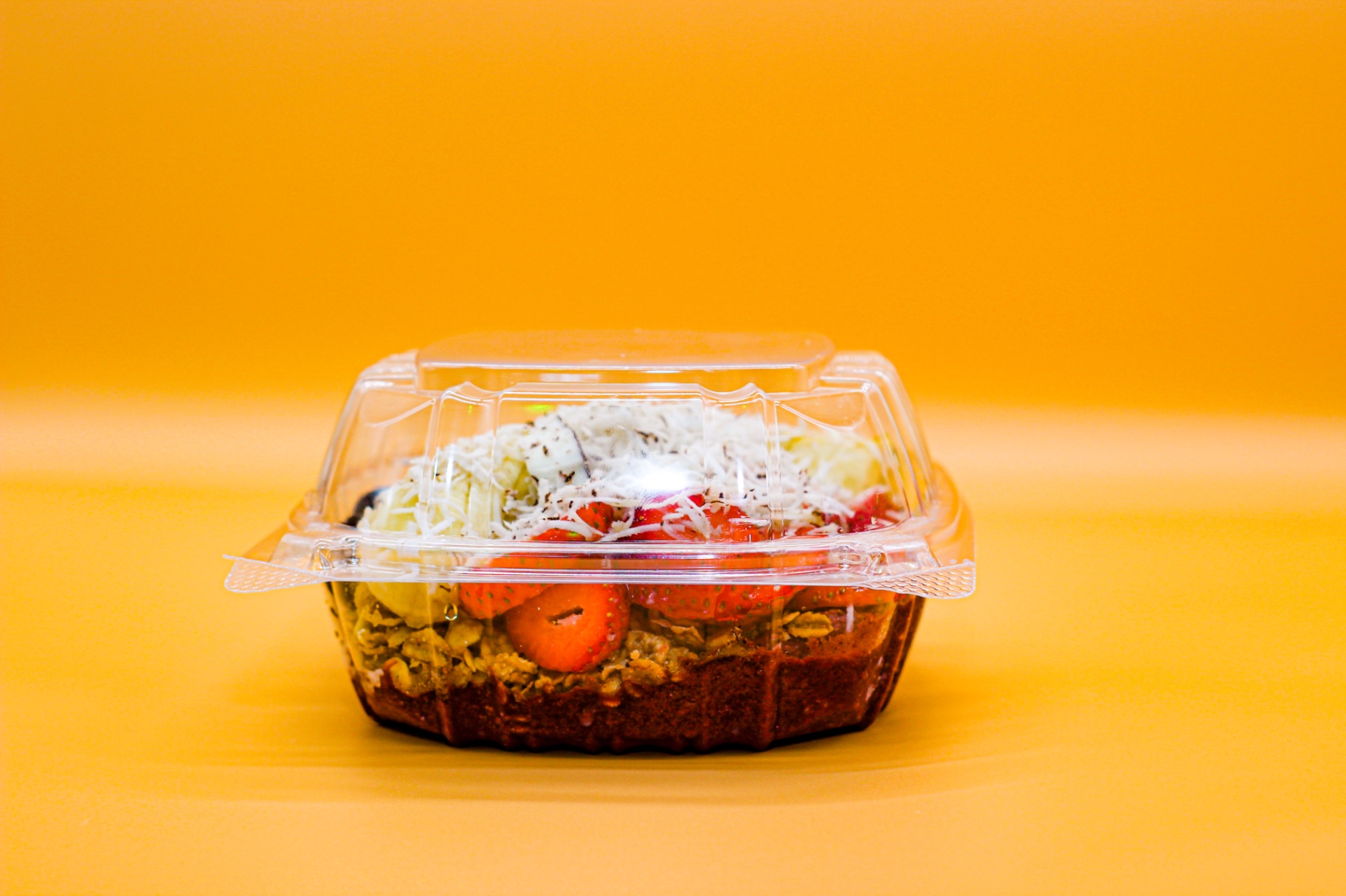Signature acai bowl in takeaway container